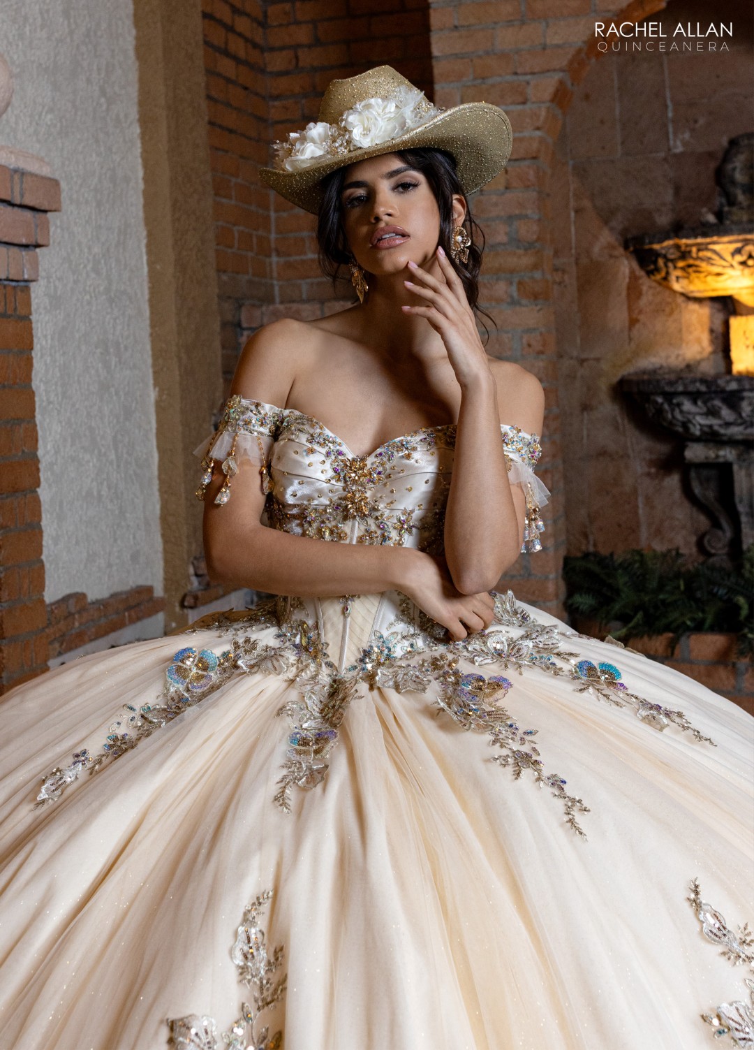 5.	Rachel Allan Style RQ2228 sweetheart ball gown with crystal satin details, regal applique, and detachable bodice liner in champagne gold